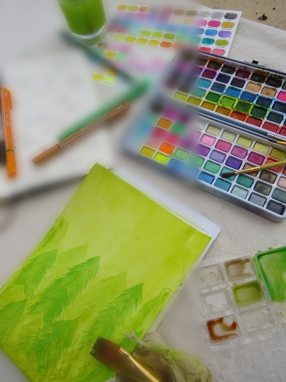 Adèle's watercolour workspace, painting the artwork for Who Is He